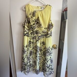 Sheer, lined yellow floral dress with zippered back.